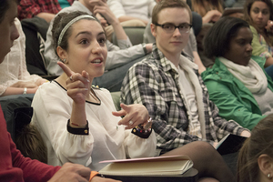 Lara Alkarim, a freshman political science and Middle Eastern studies major, discusses academic advising at the chancellor search forum that was a part of the SA meeting held Monday night.