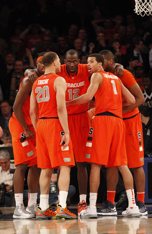 Syracuse huddles up in the final minutes of its win over Pittsburgh, preparing to stave off a final Panther run.