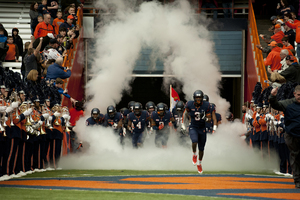 Durell Eskridge leads Syracuse on to the field before its 17-16 loss to Pittsburgh. The SU safety logged 12 tackles and nearly caught a touchdown pass.