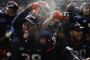 Cameron Lynch and Syracuse celebrated after winning the Pinstripe Bowl last year. Now, SU is heading to the Texas Bowl on Dec. 27, where it will play Minnesota.