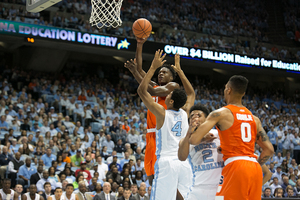 Tyler Roberson unleashes a right-handed shot over UNC's Kennedy Meeks.