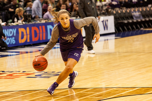 Alexus Atchley drives toward the basket in Washington's open practice on Saturday before playing Syracuse in the Final Four on Sunday night.