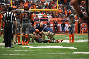 Eric Dungey had been having a stellar first half against No. 17 Virginia Tech until he was injured. He briefly left the game, but he returned with a knee brace later. 