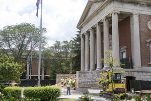 Construction crews work on the new steps that lead to the entrance of Hendricks Chapel.