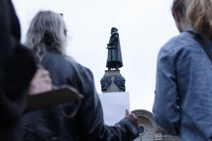 Demonstrators gathered near the Christopher Columbus statue in downtown Syracuse to promote the renaming of Columbus Day. 