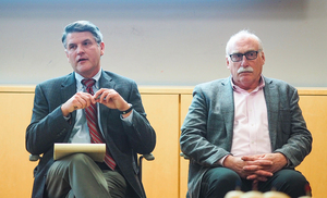 Wes Rodgers and Thomas Dennison, a consultant and professor in the Maxwell School of Citizenship and Public Affairs, respectively, speak to students about alternatives to the current graduate student health care program.