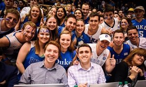 Sam Fortier (left) and Matthew Gutierrez (right) covered Syracuse versus Duke amid the Duke fans. 