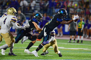 Jaiquawn McGriff dives for a touchdown for Cicero-North Syracuse, which jumped two spots to No. 4 in Class AA this week.