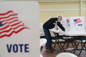 Poll workers at the county's polling places frequently sanitized areas where voters filled out their ballots. 