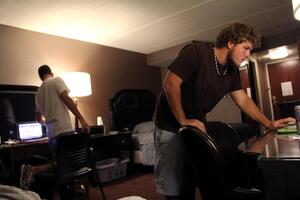 Bram Berkowitz (left) and Pat Nolan, a sophomore advertising major and sophomore advertising and information technology major, hang out after the first day of classes in their room at the Sheraton Hotel. The roommates can use the pool and fitness center in the hotel, too.