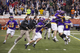 The Albany Great Danes celebrate the first win against Syracuse in program history. Miles Thompson scored the game-winning goal with 3:03 remaining in the second overtime.