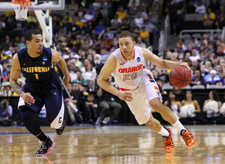 Brandon Triche #20 drives the ball down the court against Justin Cobbs #1 of the California Golden Bears.