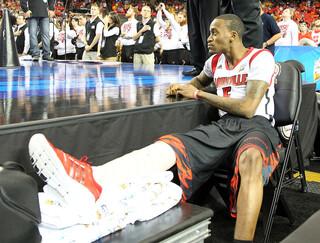 Kevin Ware watches Louisville play Wichita State as he rests his leg.