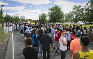 Students wait in line outside the entrance of Juice Jam 2013.