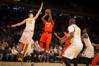 Joseph rises up for a jumper over Kravish during the second half.