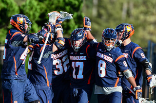 The Orange celebrate after one of its nine second-half goals.