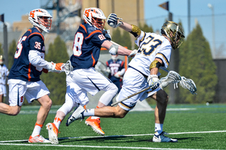 Andrew Helmer chases after Notre Dame's Timmy Phillips. 