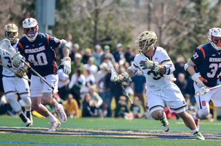 Peter Dearth gives chase to a UND player. 