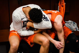 Moyer embraces Bayer outside their lockers. 