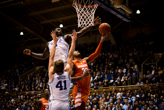 Hughes attempts a layup. He drilled a three-quarter-court shot before halftime to make it a one-point game. 