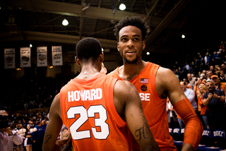 Howard and Brissett embrace at center court following the buzzer.