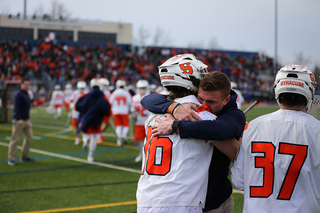 Brendan Curry (16) hugs injured Tucker Dordevic. 