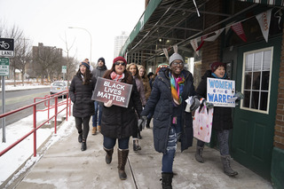 March organizers Nada Odeh and Nodesia Hernandez lead protesters along the sidewalks toward the United Methodist Church. 