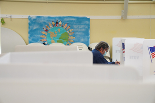 A voter fills out their ballot at the Spiritual Renewal Center.