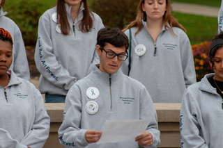 Ronald Ditchek, who represents Pan Am Flight 103 victim Nicholas Andreas Vrenios, reads the names of several Pan Am Flight 103 victims during this year’s candlelight vigil. During the event, each scholar wore a pin reading “In Remembrance Of The Victims of Pan Am Flight 103.”