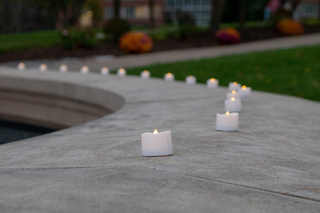 Remembrance Scholars and attendees placed electric candles on the memorial surrounding the Place of Remembrance. The university chiseled the names of the 35 students in SU’s abroad program who died 34 years ago into the wall.