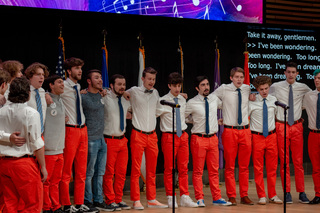 As they sang “Home (I Am)” by George Kamel, the male a capella group OttoTunes embraced one another. All of the members swayed back and forth as they performed the emotional song. 