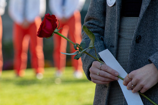 Each Remembrance scholar is given a rose to place on the Remembrance Wall during the ceremony. After reading a short statement written about the victim they represented, scholars placed their rose alongside the candles already sitting on the wall. 