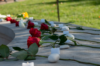The Remembrance Wall sits adorned with roses, stones and candles, all placed in memory of those whose lives were taken away too soon by tragedy. Each item holds a special meaning. 